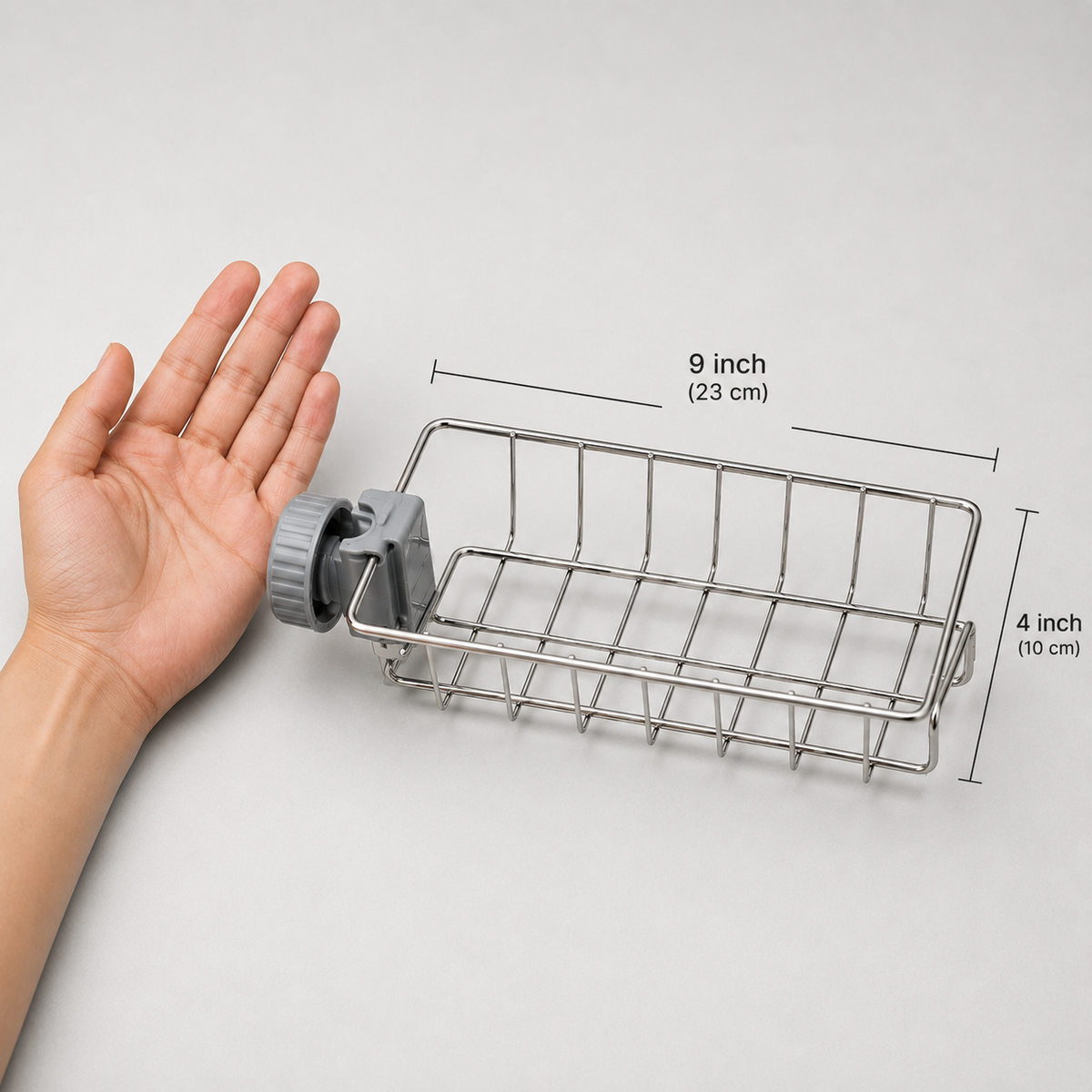 The rack next to an open hand for scale, labelled 9 inch (23 cm) long and 4 inch (10 cm) deep